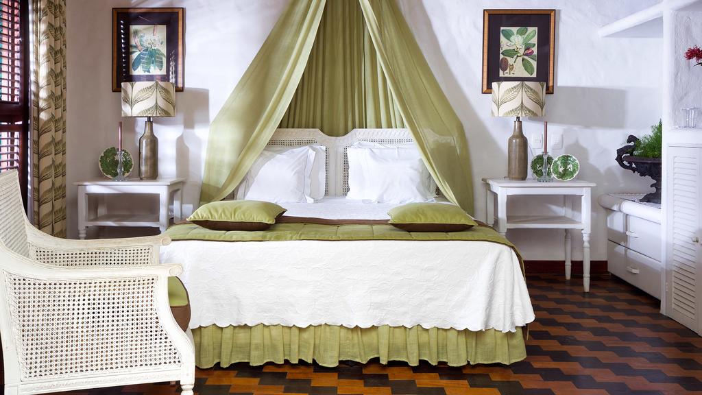 Quarto com decoração fina na pousada de charme Casa de São José